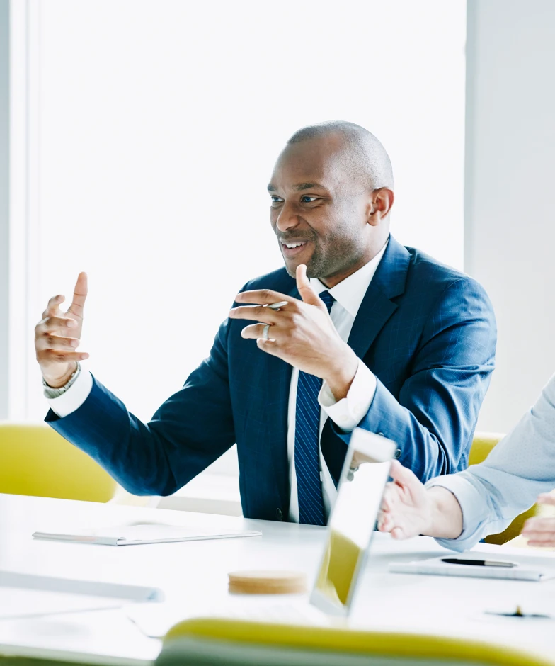 A man speaking during a team meeting. Learn more about Stifel Commercial Banking and Treasury Management