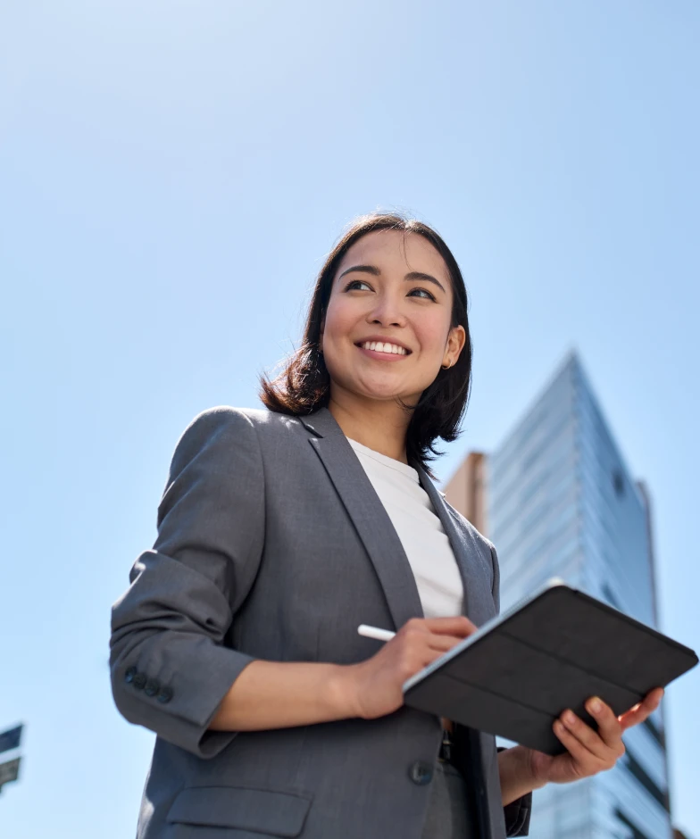 An experienced developer working on a tablet to build opportunities for her clients.