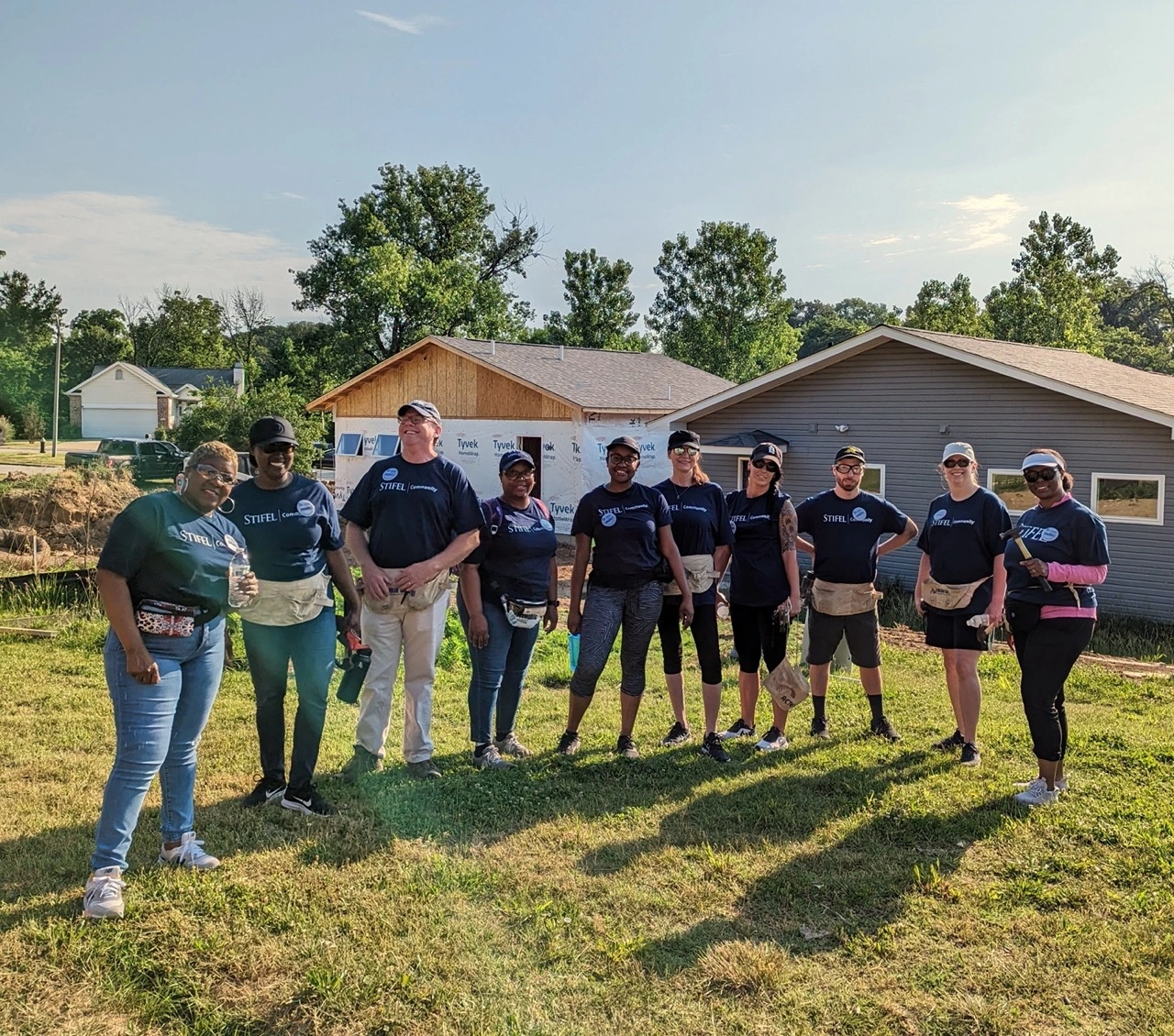 Stifel Associates Volunteering at a build site to support the community.