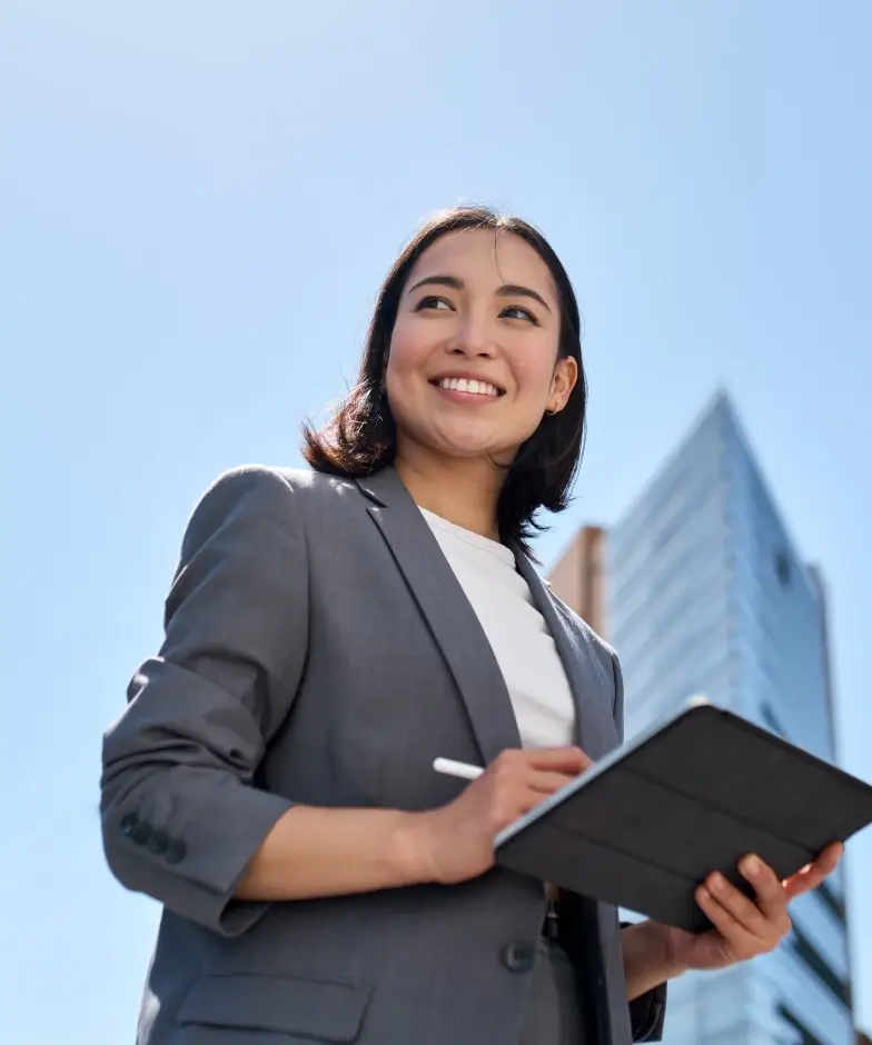 An experienced developer doing work on a tablet. Learn more about Stifel Commercial Real Estate Lending.