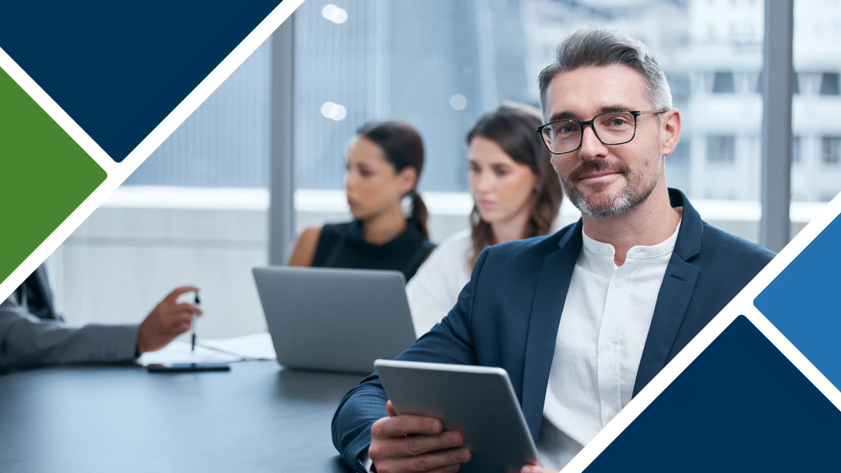 When to Choose an Independent Trustee: Stifel Trust Services. A man in a meeting smiling and holding a tablet.